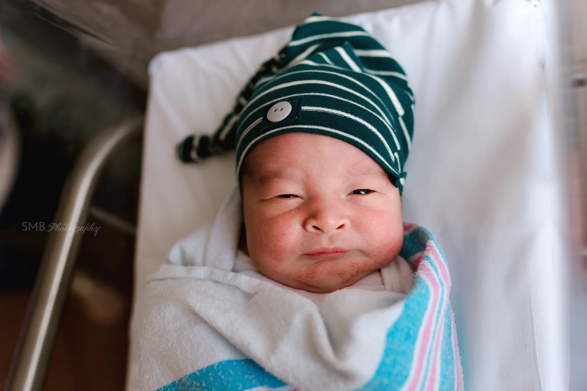 Newborn swaddled in hospital blanket