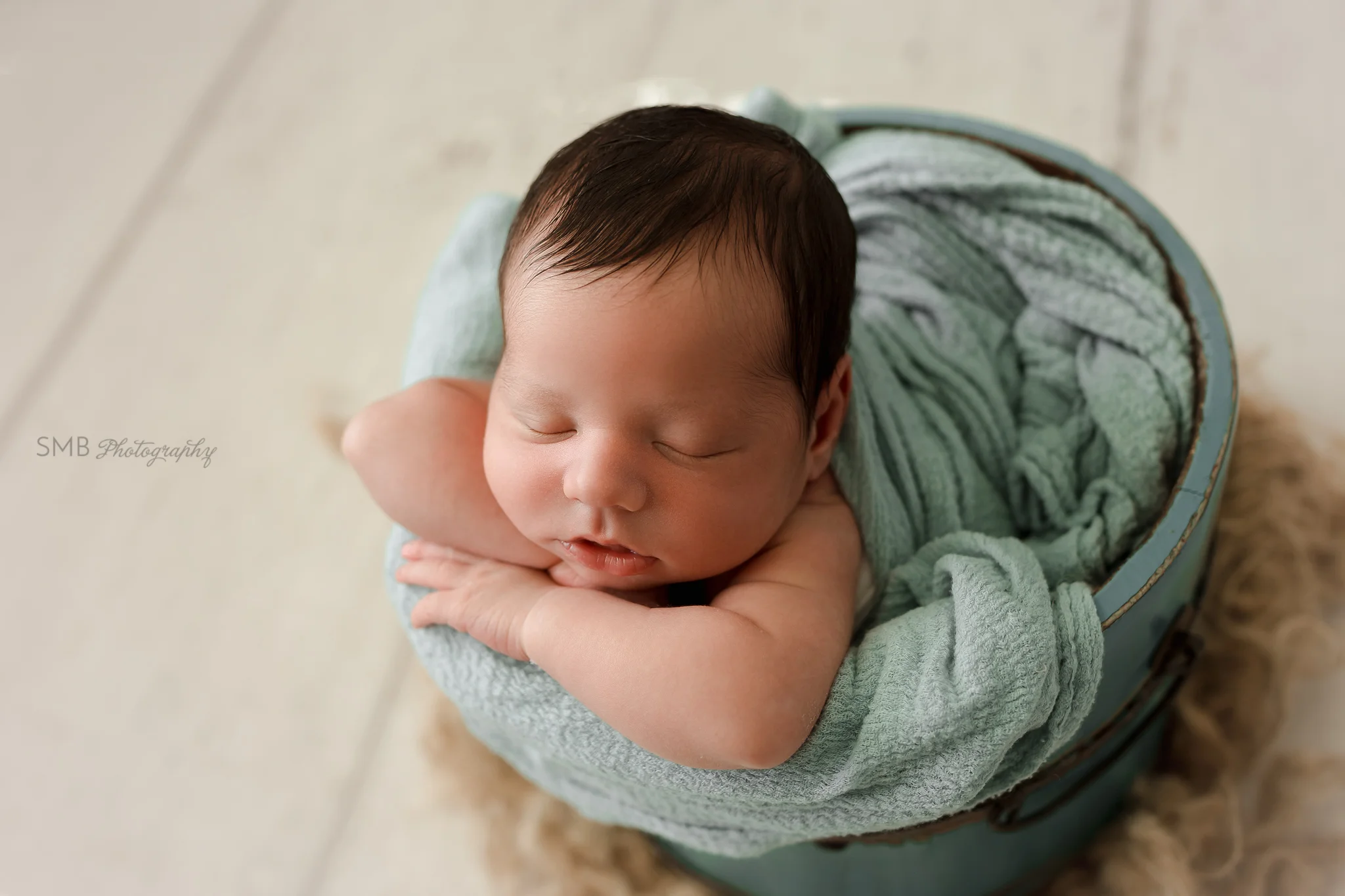 Closeup of baby in bucket