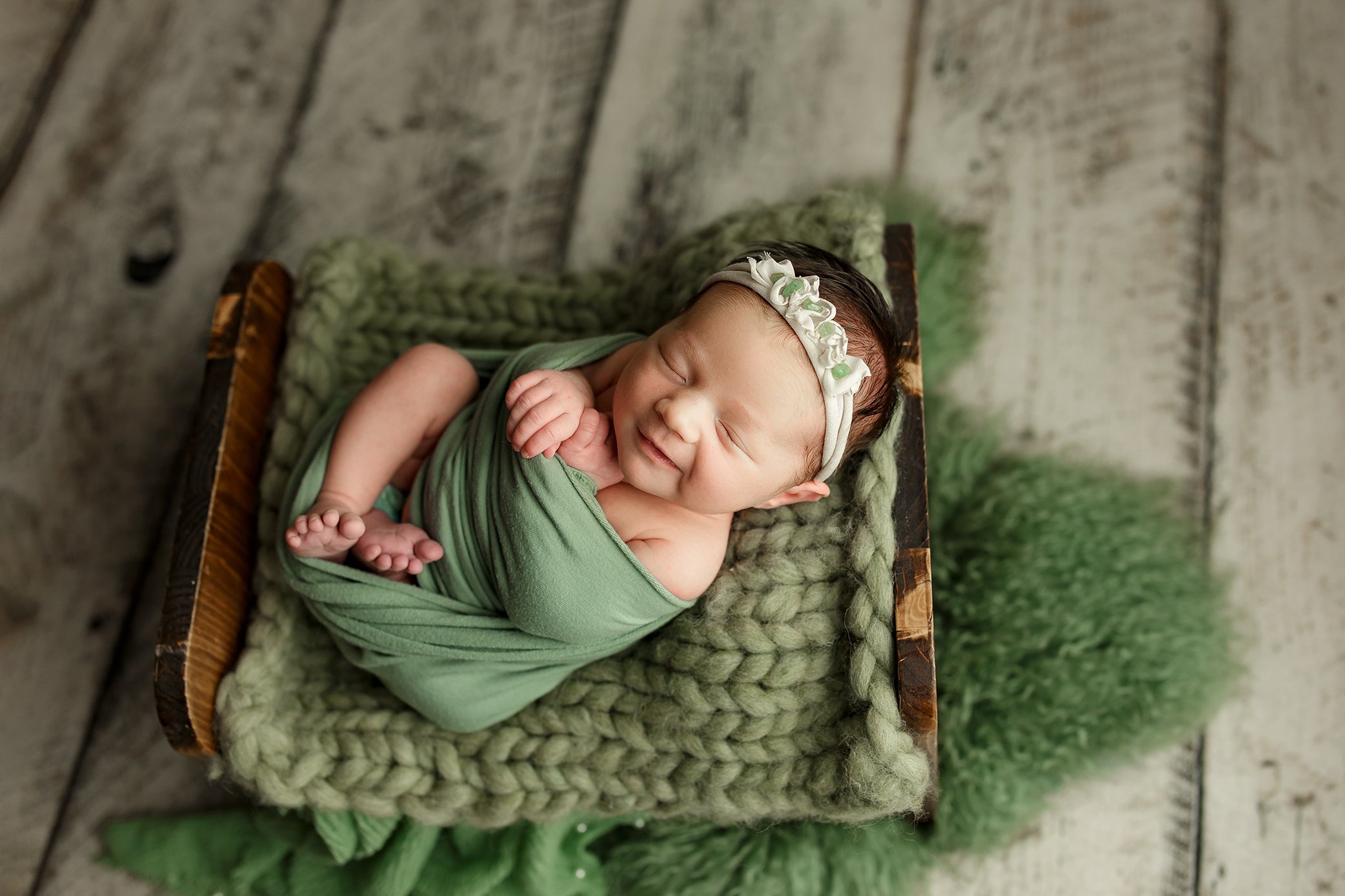 Newborn baby girl smiling