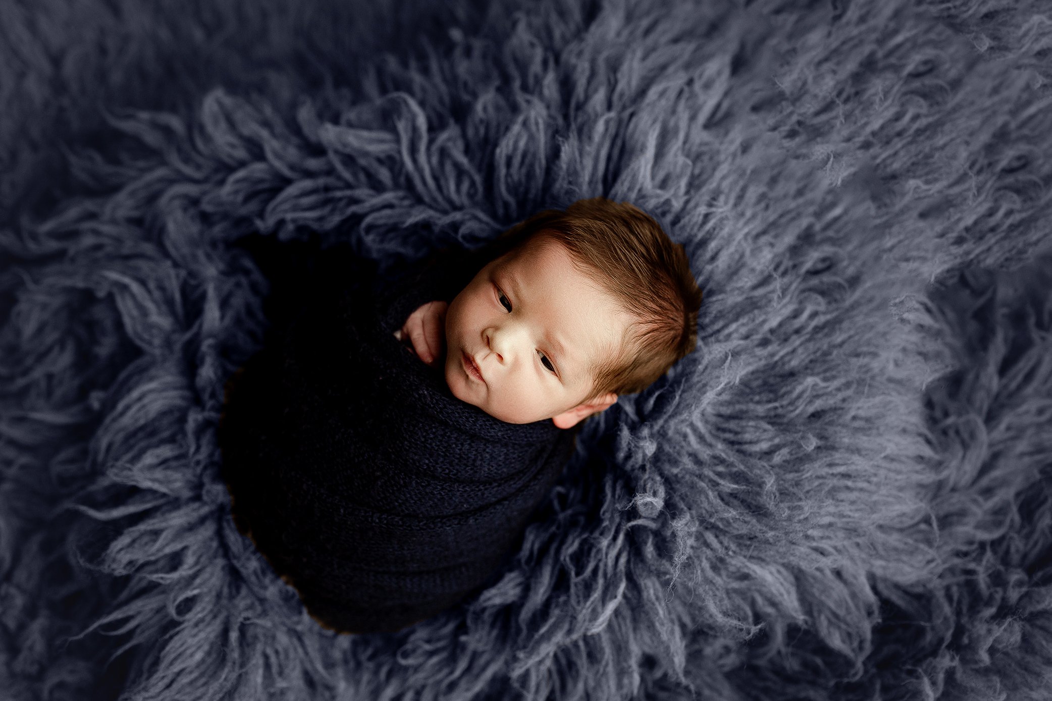 Newborn boy making eye contact 