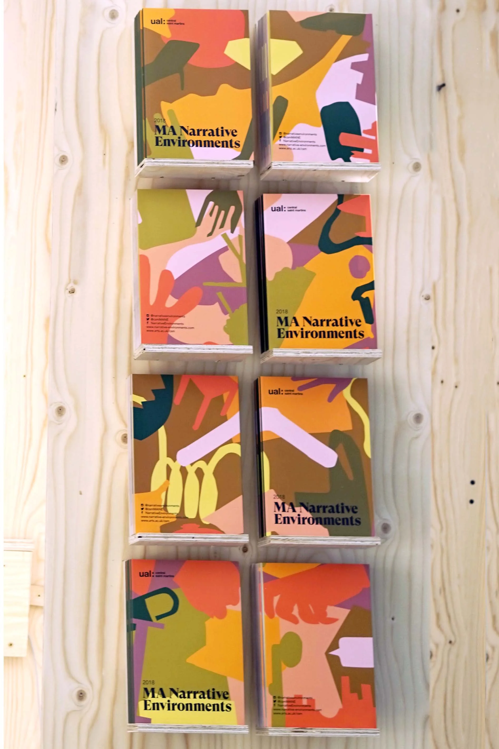 There are four different covers in the catalogue. They are meant to be placed in the exhibition so that they connect and form the full image with all of the shapes in the visual identity.