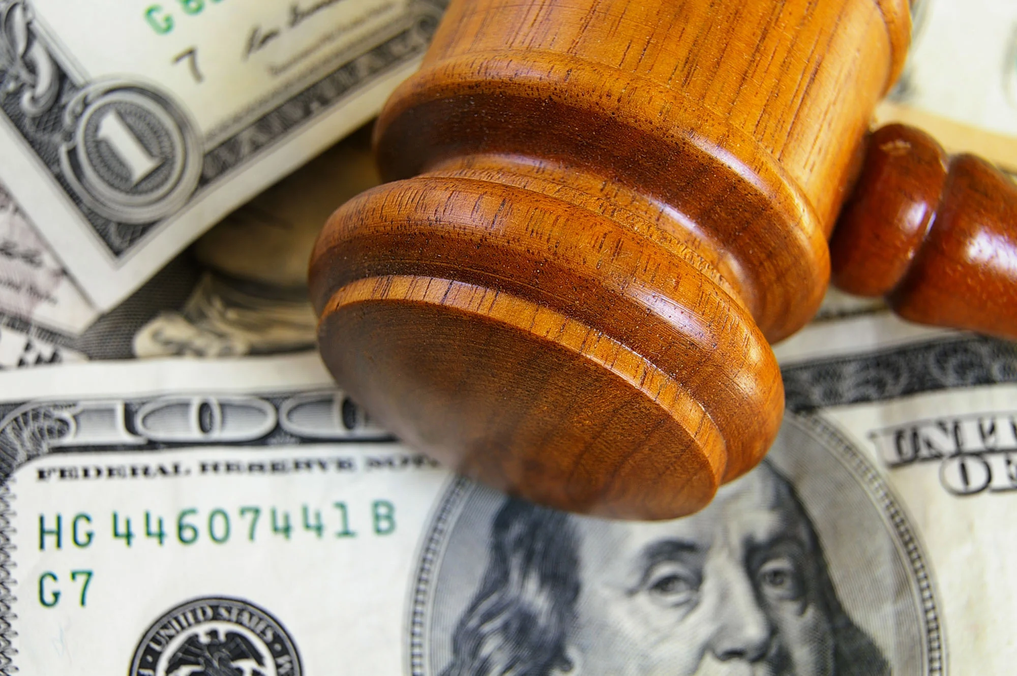 bigstock-gavel-on-cash-31505699.jpg