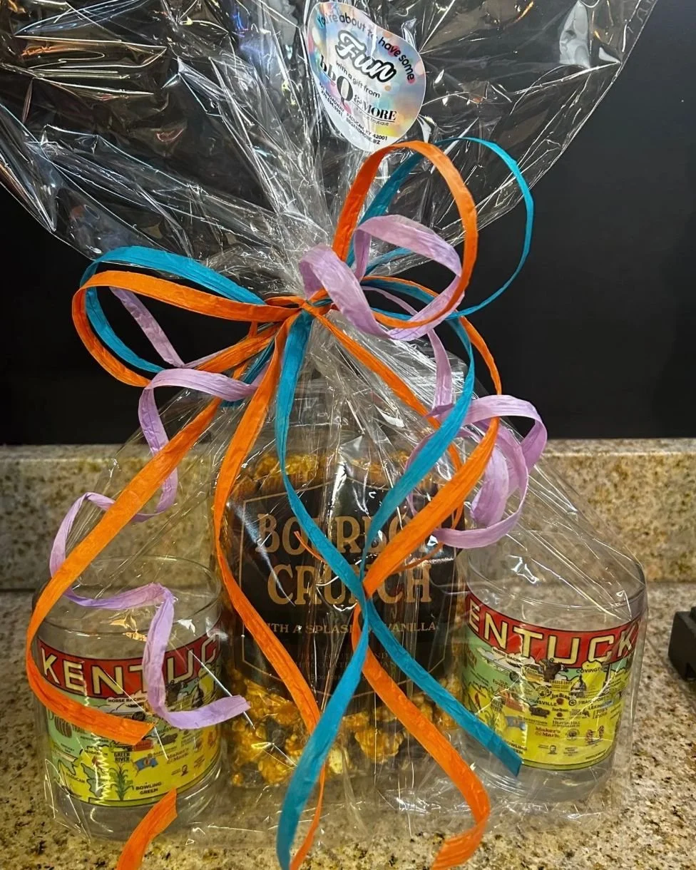 COMFORT &amp; CRUNCH

 A warm, personality-filled bundle that captures the spirit of relaxed gatherings and simple pleasures. This gift-ready pairing features a crave-worthy bourbon crunch snack at the center, flanked by distinctive Kentucky-themed g