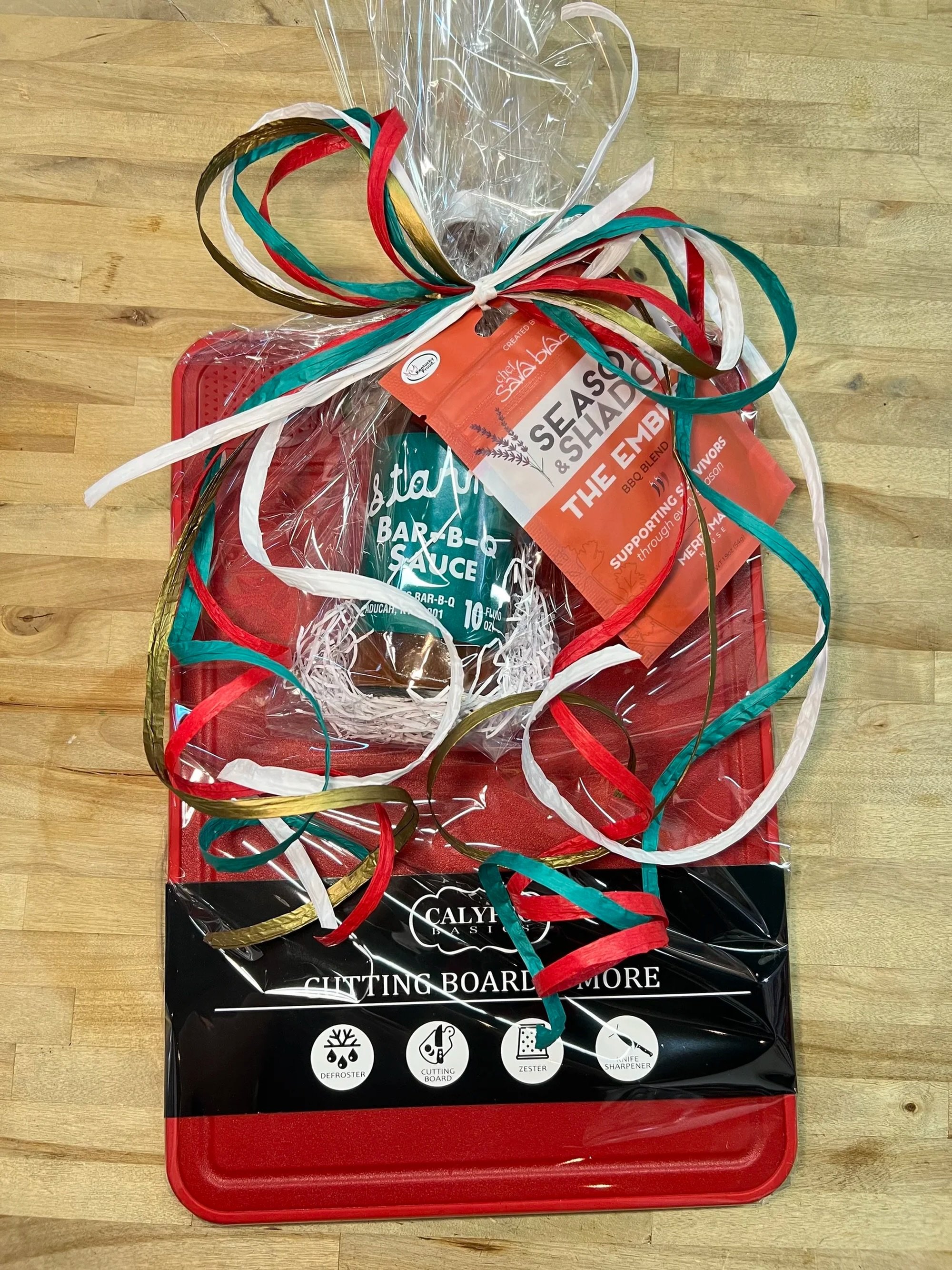 KITCHEN MVP

 A practical kitchen favorite packed with bold Kentucky flavor.

Includes:
&bull; Calypso Red Cutting Board with built-in defroster, zester, and knife sharpener
&bull; Starnes BBQ Sauce
&bull; Season &amp; Shadow BBQ Blend

Perfect for g