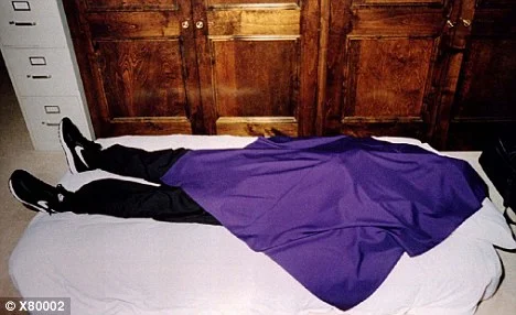 A cult member after the suicide, seen wearing the cult signature cortez and the purple cloth.