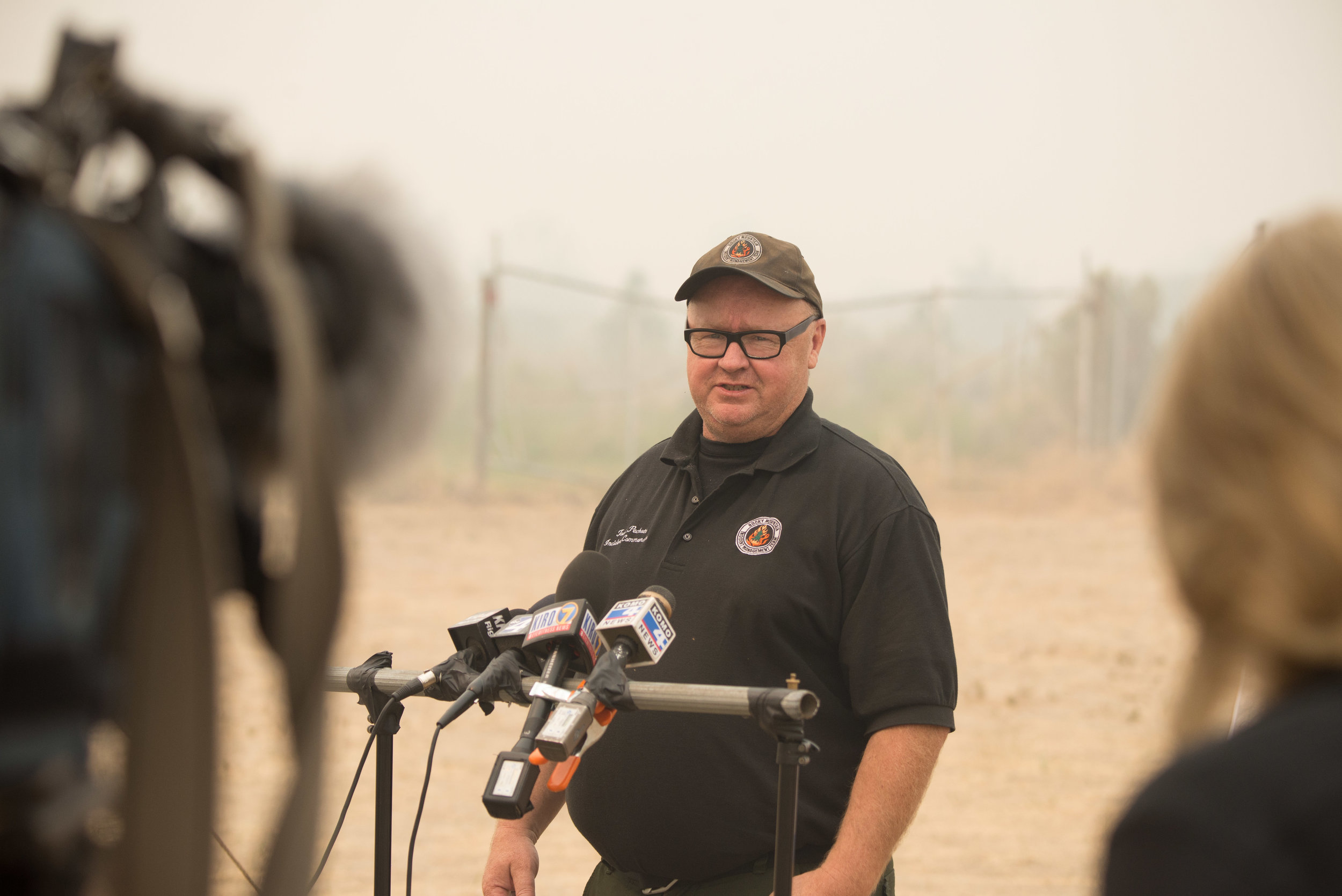  Incident Commander Todd Pachota briefs the media at the Incident Command Post Omak after a night of fire activity in Okanogan County, Sunday August 23, 2015. Level 3 Evacuation Levels were expanded at this time to include Malott, Aenes Valley, Conco