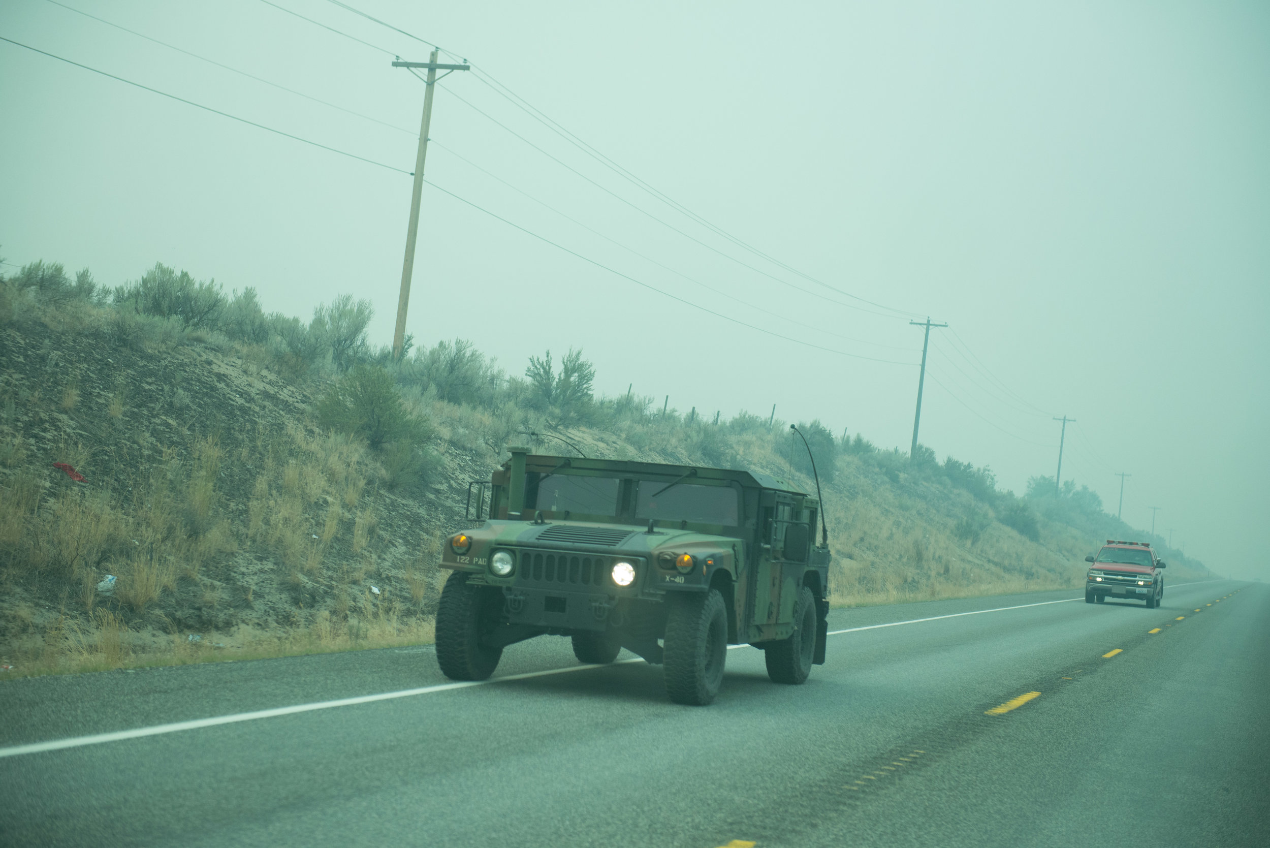  A US National Guard Humvee leaves the Incident Command Post Omak with a Fire vehicle following behind Monday August 24, 2015. Members of the US National Guard from Joint Base Lewis McChord were called in to support fire-fighting efforts in Okanogan 