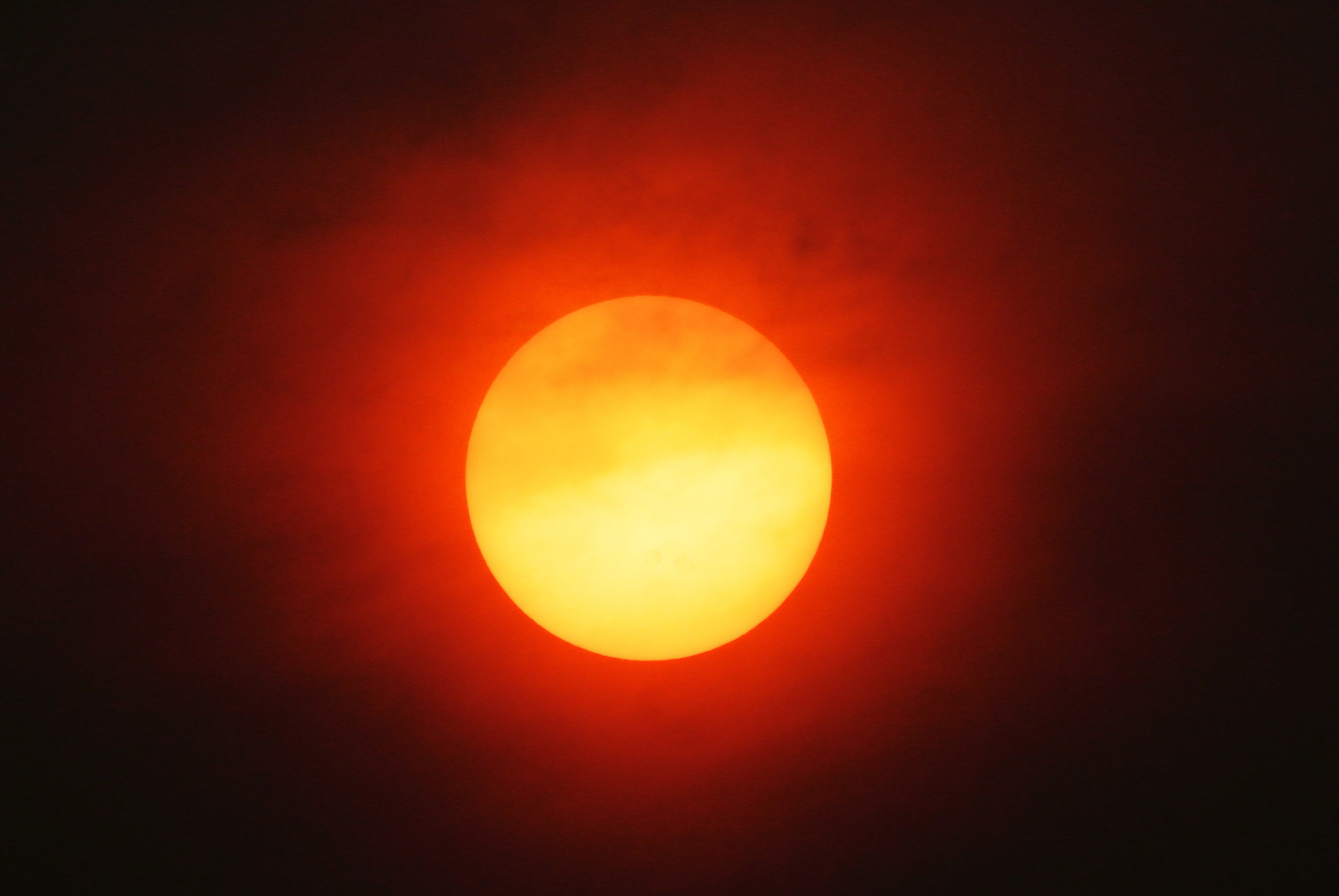  The Sun observed through thick smoke in Chelan county Monday, August 24, 2015. By this time the weather inversion had began to lift, bringing clearer skies and increased winds. 