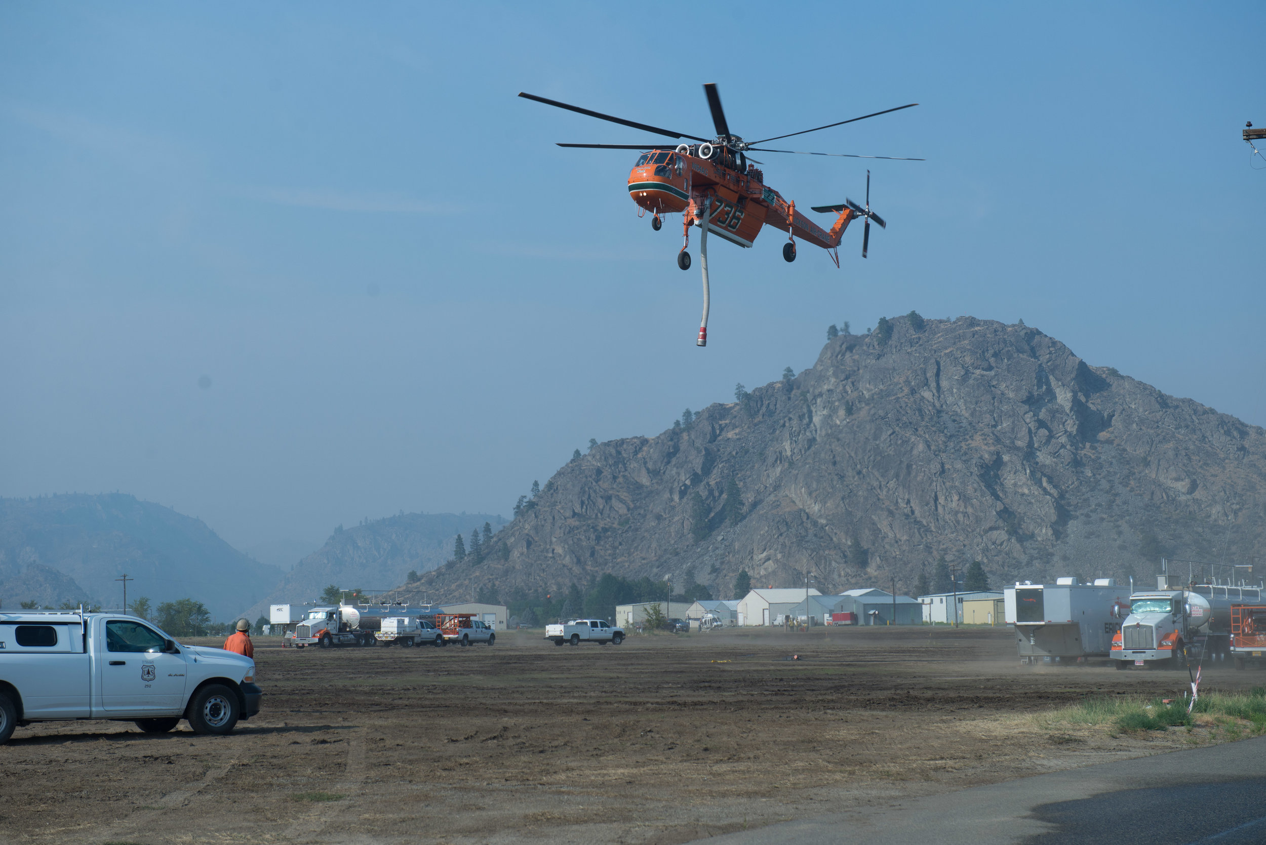  "Incredible Hulk", an Aircrane Helicopter operated by Erickson Aviation, lifts off from Lake Chelan Airport, Tuesday August 25, 2015. Commercial fire fighting has been crucial in containing fires throughout Washington State. 