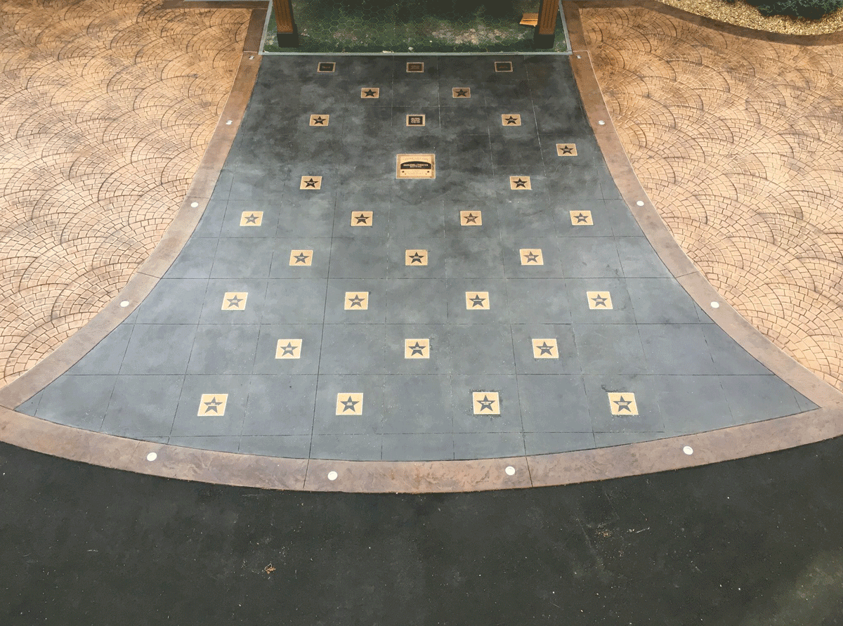 masterwork-plaques-walk-of-fame-inset-inground-plaque-underfoot-plaques-custom-bronze-plaque-canobie-park-entrance.png