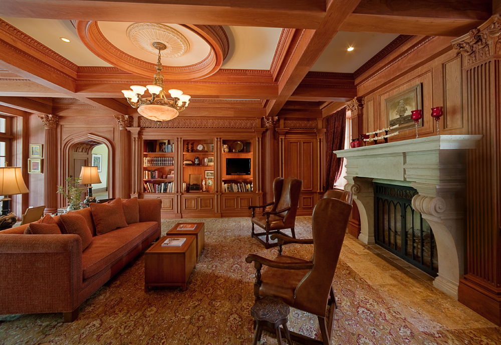   The Library.  Panelled walls and nested bookcases. 