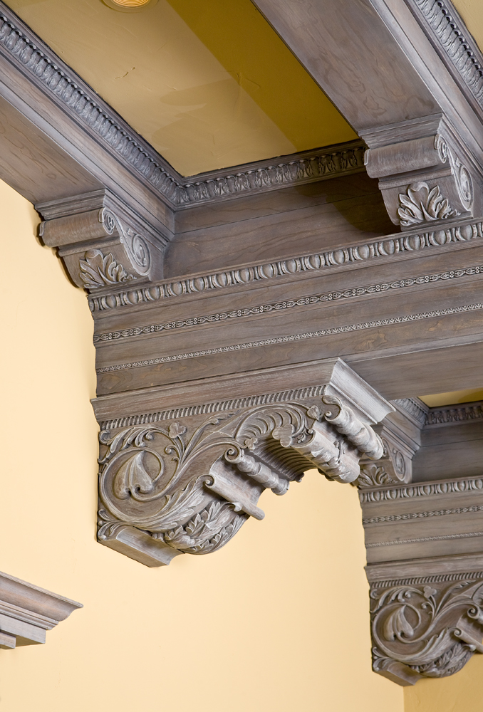   Custom handcarved corbels  feature spades, hearts, clubs and diamonds motifs. 