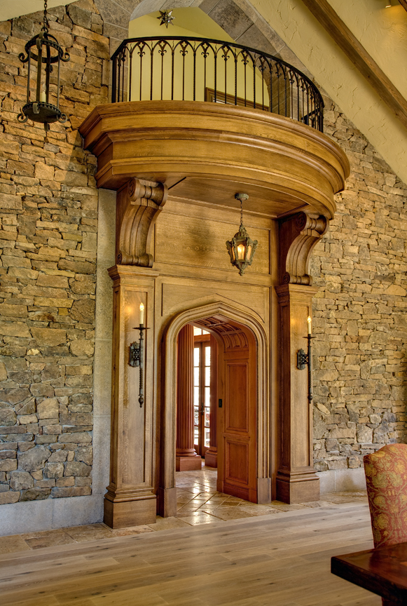 The entry to the library showcases panelled columns and oversized corbels. 