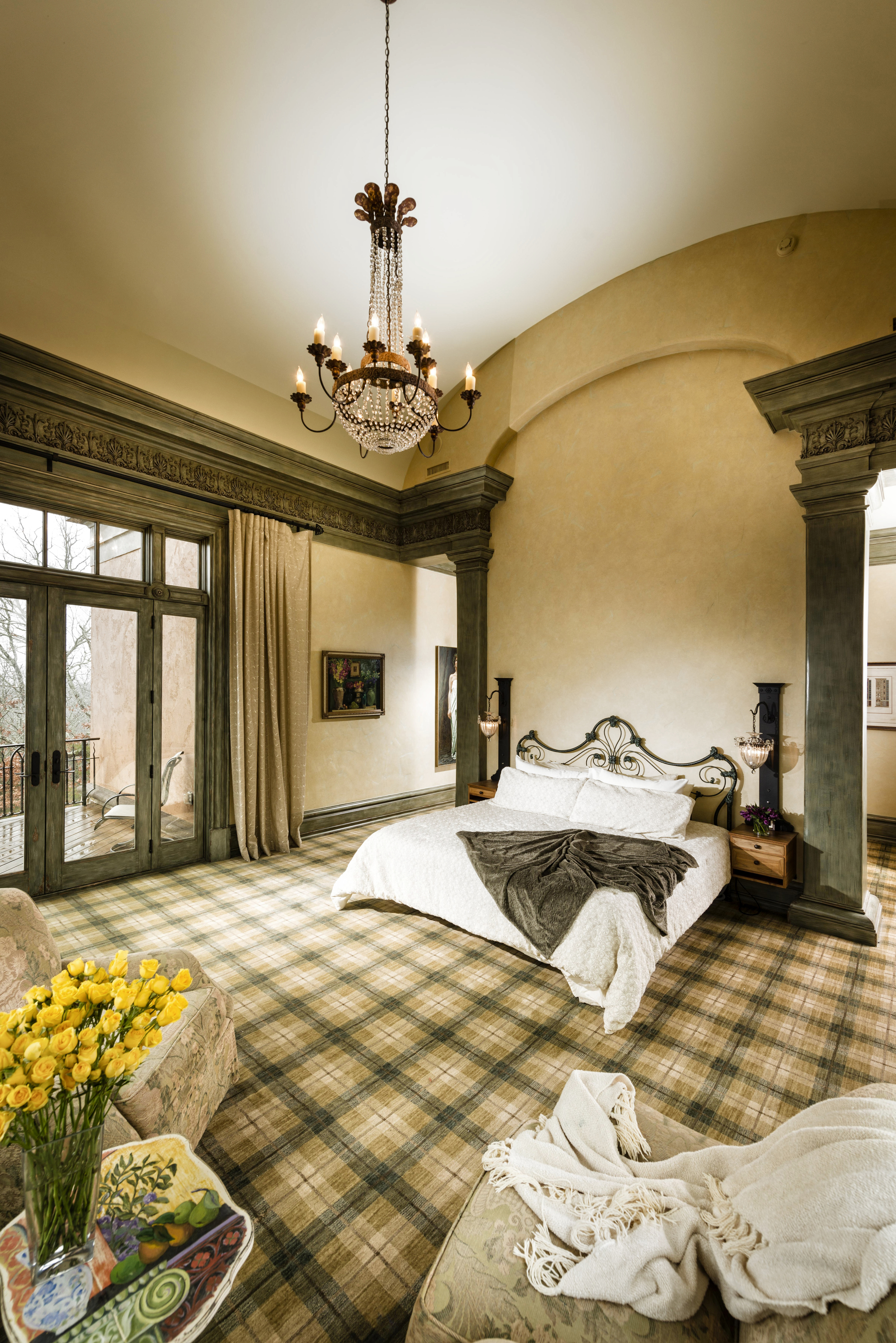 Master bedroom, opens onto intimate porch and gallery beyond.