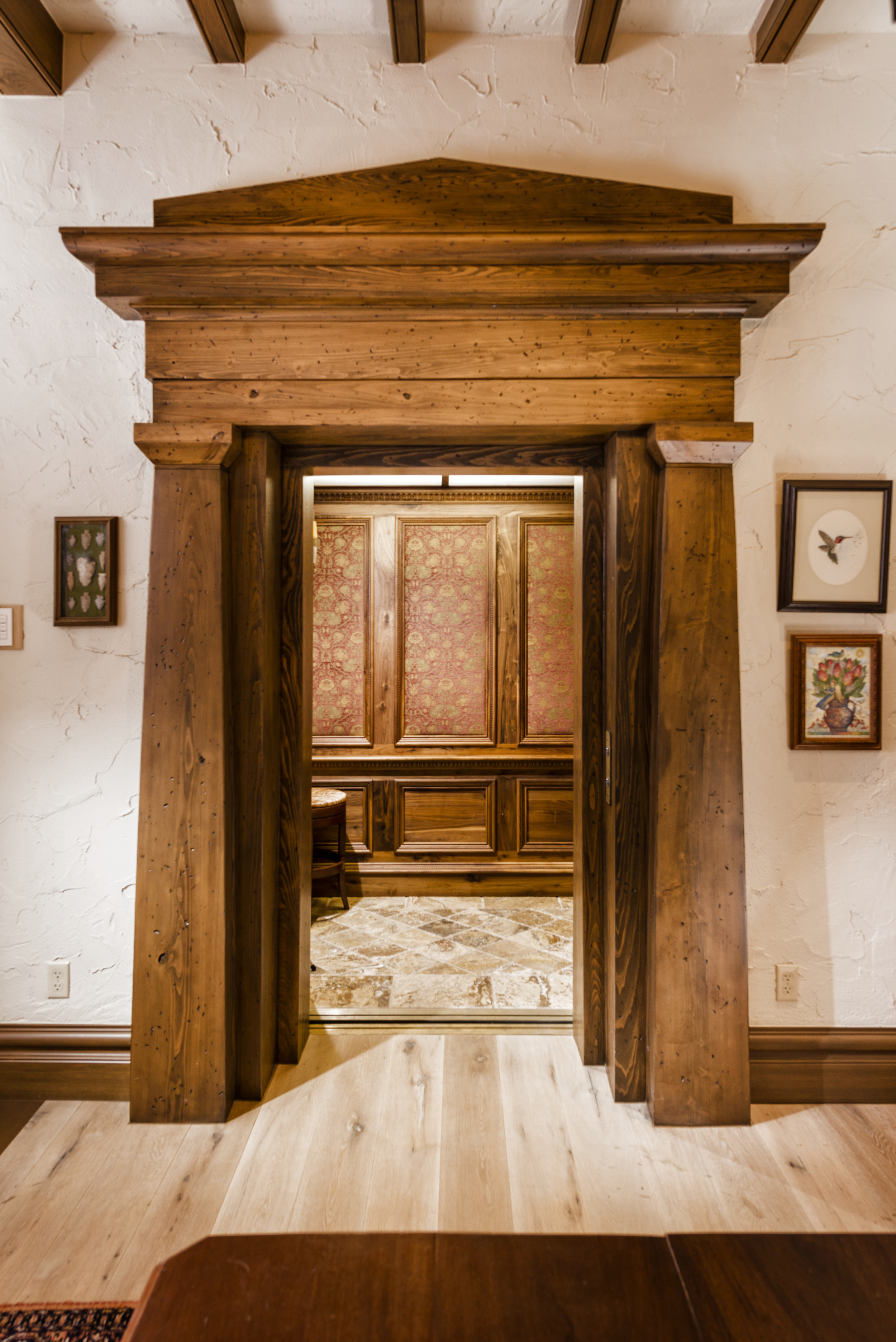  The map room elevator door. Elevator interior detailed in walnut. 