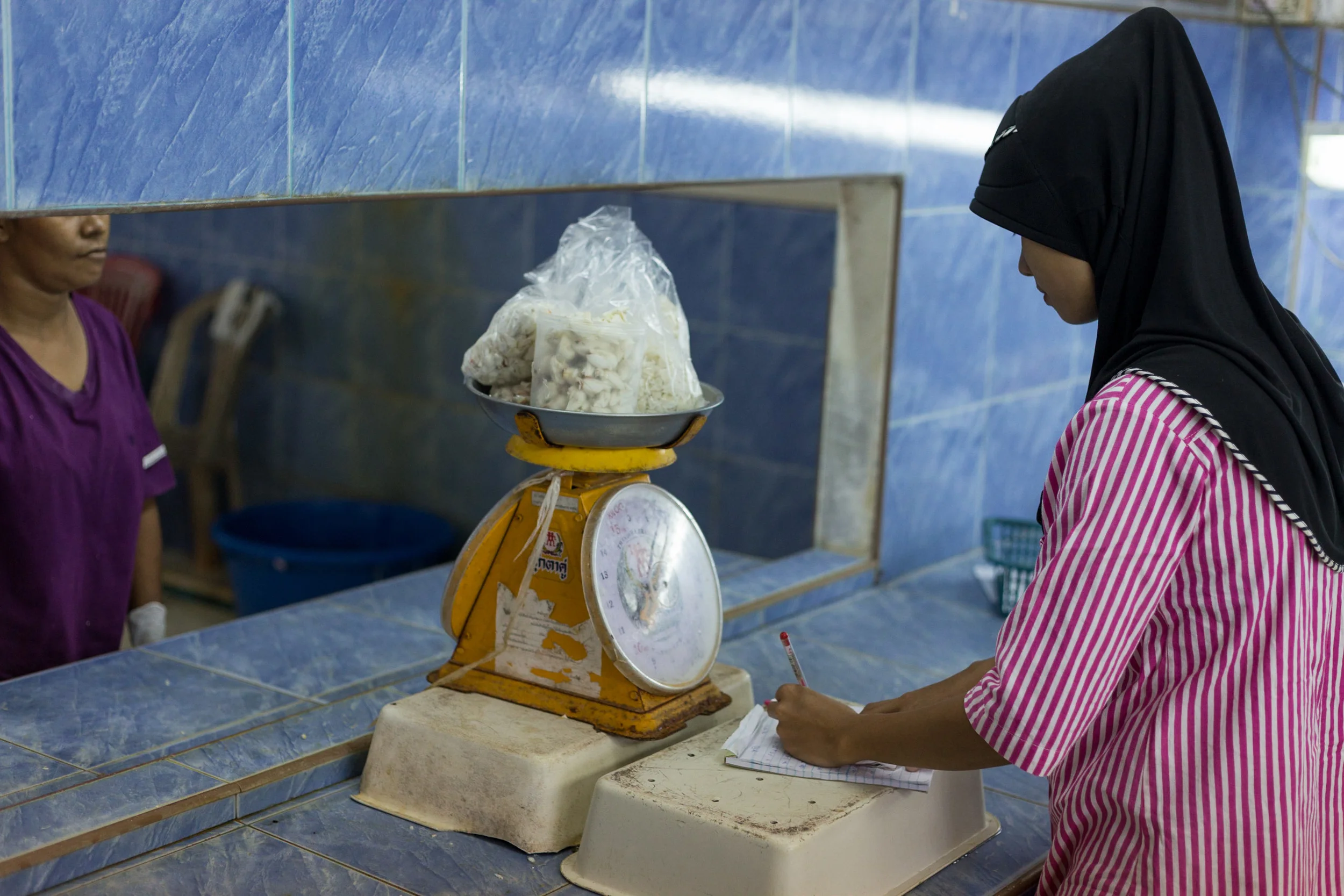 Women Weigh Lump Crab Meat