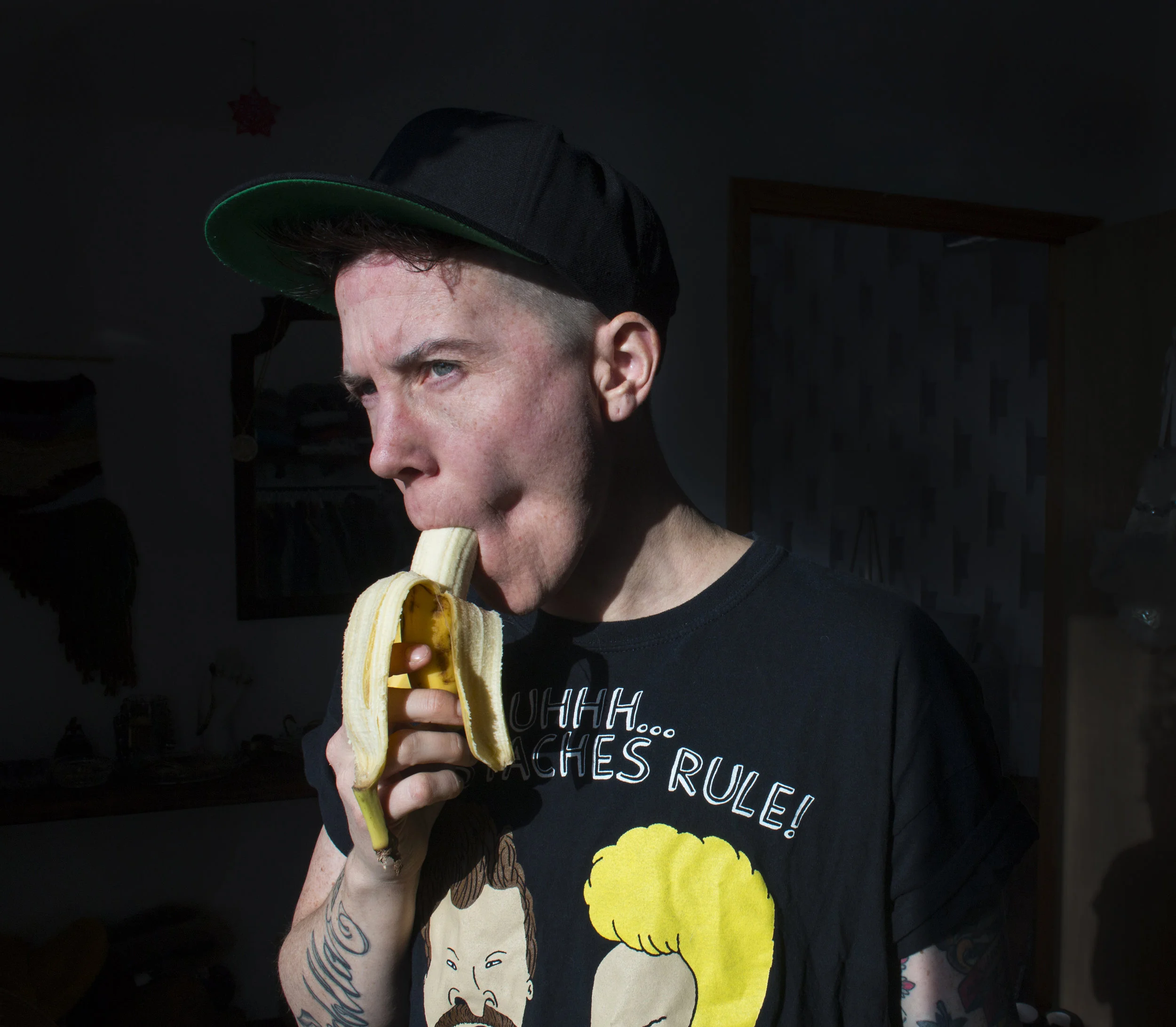 From the series, Gender is a Drag , a photo and video based work that explores and expands the space of non-binary gender. This photograph is part of a body of work comprised of videos and stills documenting the transformations I undergo due to taking hormones. There are also videos in which I discuss various topics related to gender in general, gender theory, my own experience and concepts that I am researching in conjunction with this work. Being white, able-bodied and often viewed as masculine, allows me to remain relatively safe as a non-binary person. I am in a position where I can use my privilege to make more space for non-binary and gender non-conforming people. With the increasingly popularized use of “they” as a non-binary gendered singular pronoun, people are becoming aware that not everyone fits neatly under the pronoun she or he. Rather than being excited by the possibility of new ways of being, when met with expansive forms of self-expression (i.e. people who are gender non-conforming and/or non-binary, and/or non-binary trans) most people are frightened and / or enraged by the existence of people who present identities that have not been authorized by dominant culture. We see this regularly in with the rights for trans bathroom bills, with the murder of gender non-conforming people and violence and hate crimes perpetrated against non-binary people.