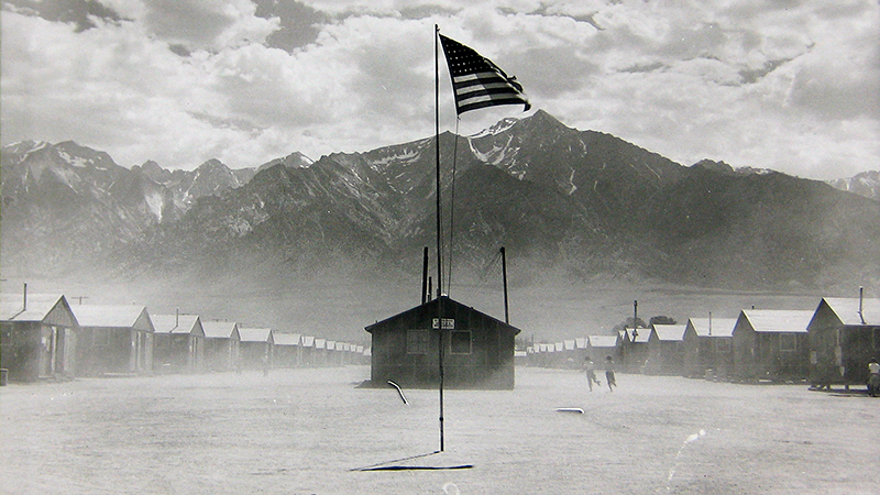 Dorothea Lange, 'Manzanar, California. Dust storm at this War Relocation Authority center where evacuees of Japanese ancestry are spending the duration, July 3, 1942.' (Courtesy of OMCA)