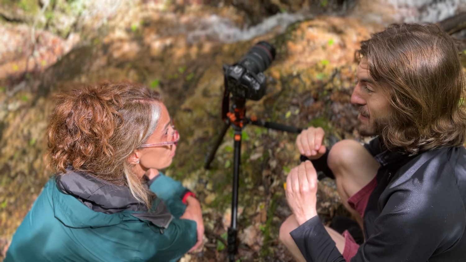 Adam explaining camera technique to a participant during an on-location photography workshop