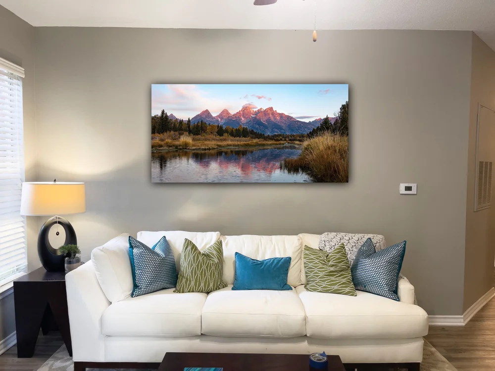 A client room visualization showing photographic art above a sofa
