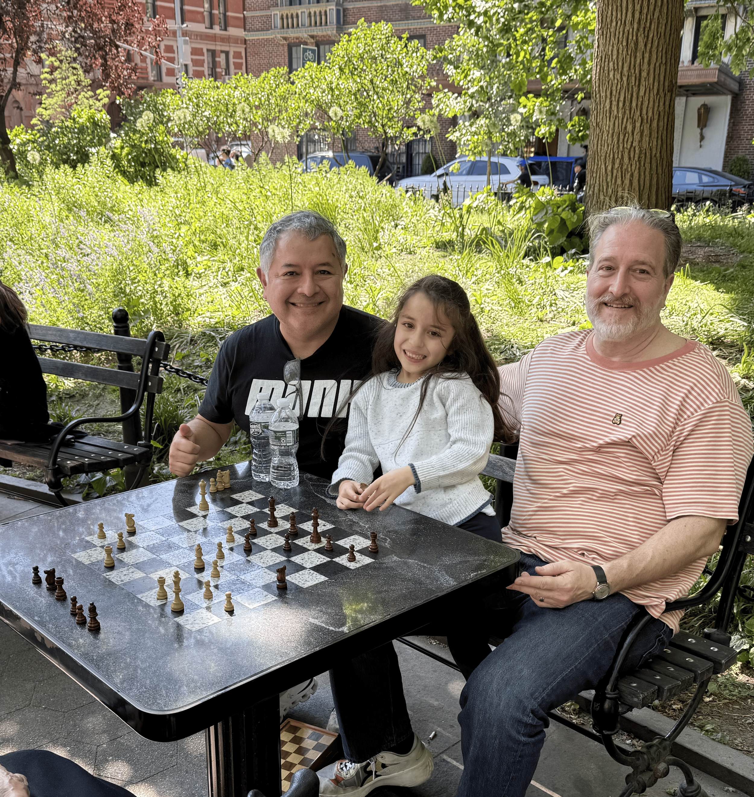 Bianca Vargas added from the waitlist plays chess while father Jorge Vargas and uncle Adolfo Vargas cheer her on