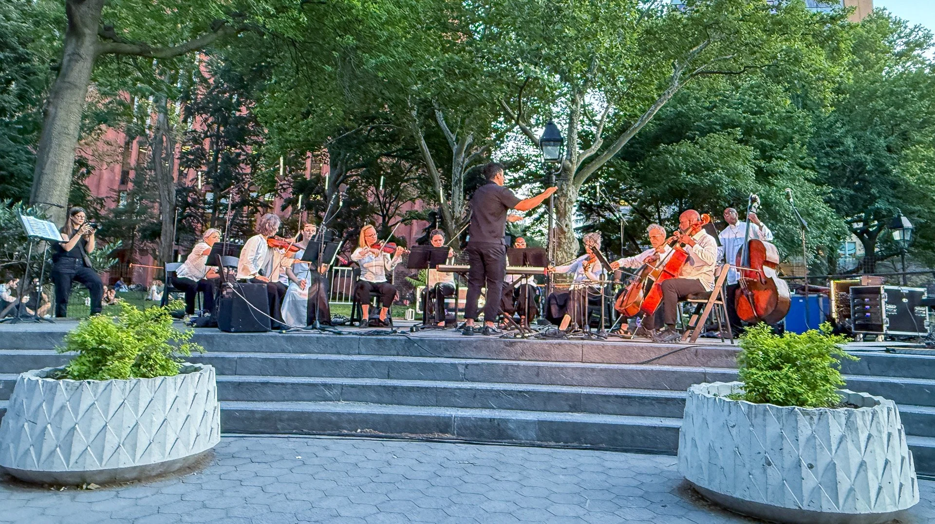 The Washington Square Festival Chamber Ensemble performs on the Garibaldi Plaza stage as Festival Music Director, Ahmed Alom, conducts. Photo by Sally Blair.