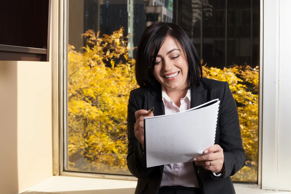 Irina Popa-Erwin reviewing coaching notes in her New York City office