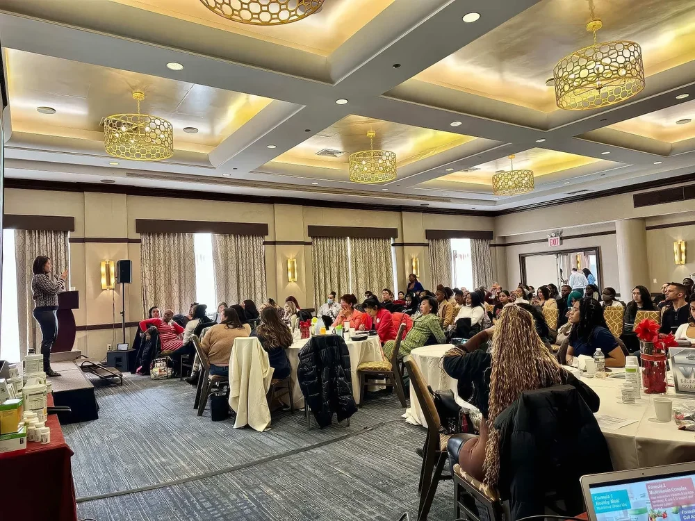 High-performance coach Irina Popa-Erwin delivering an executive leadership and performance coaching presentation to professionals in New York City.