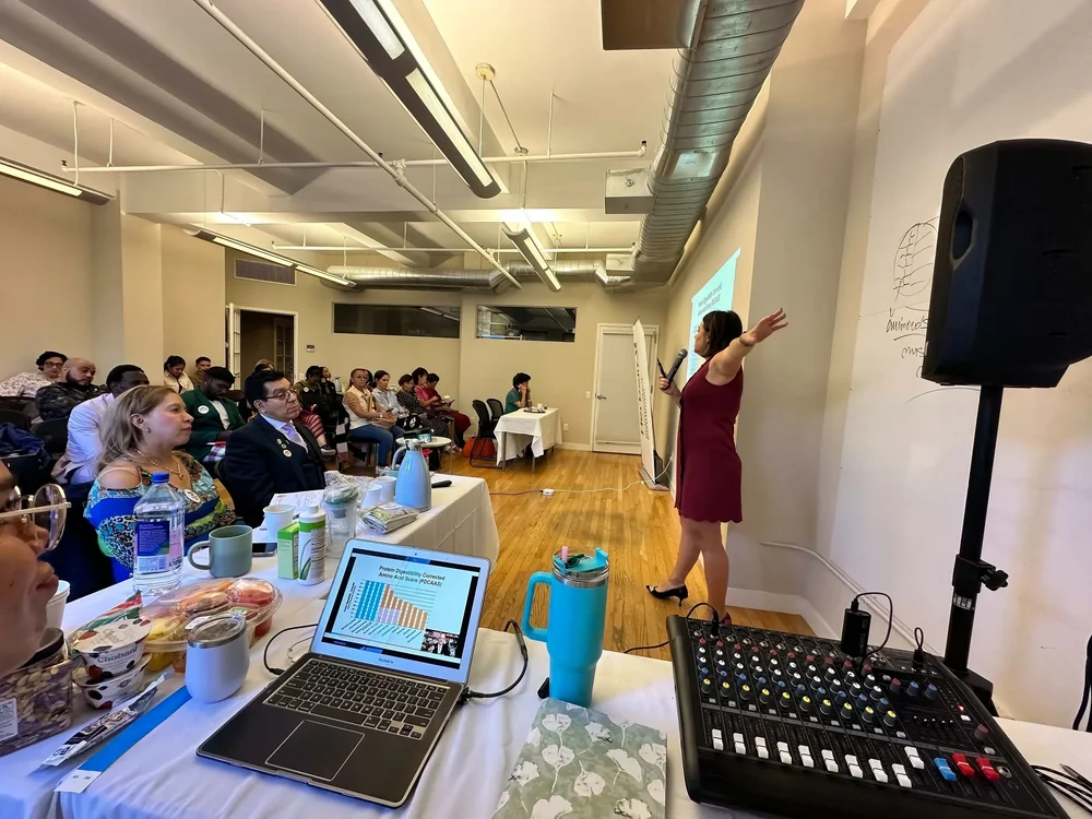 Irina Popa-Erwin speaking to a professional audience in New York City