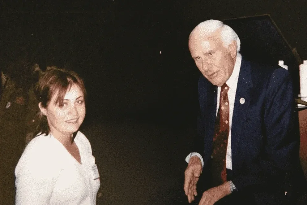 Irina Popa-Erwin with her mentor Jim Rohn in 2004