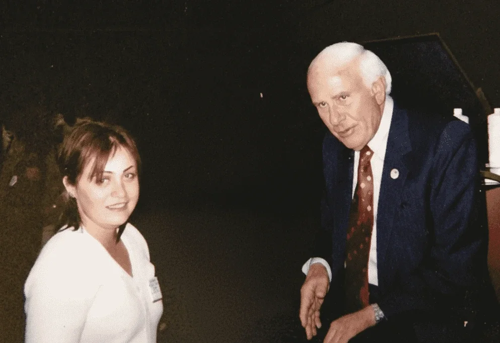 NYC Leadership Coach Irina Popa-Erwin with her mentor Jim Rohn during a professional development event.