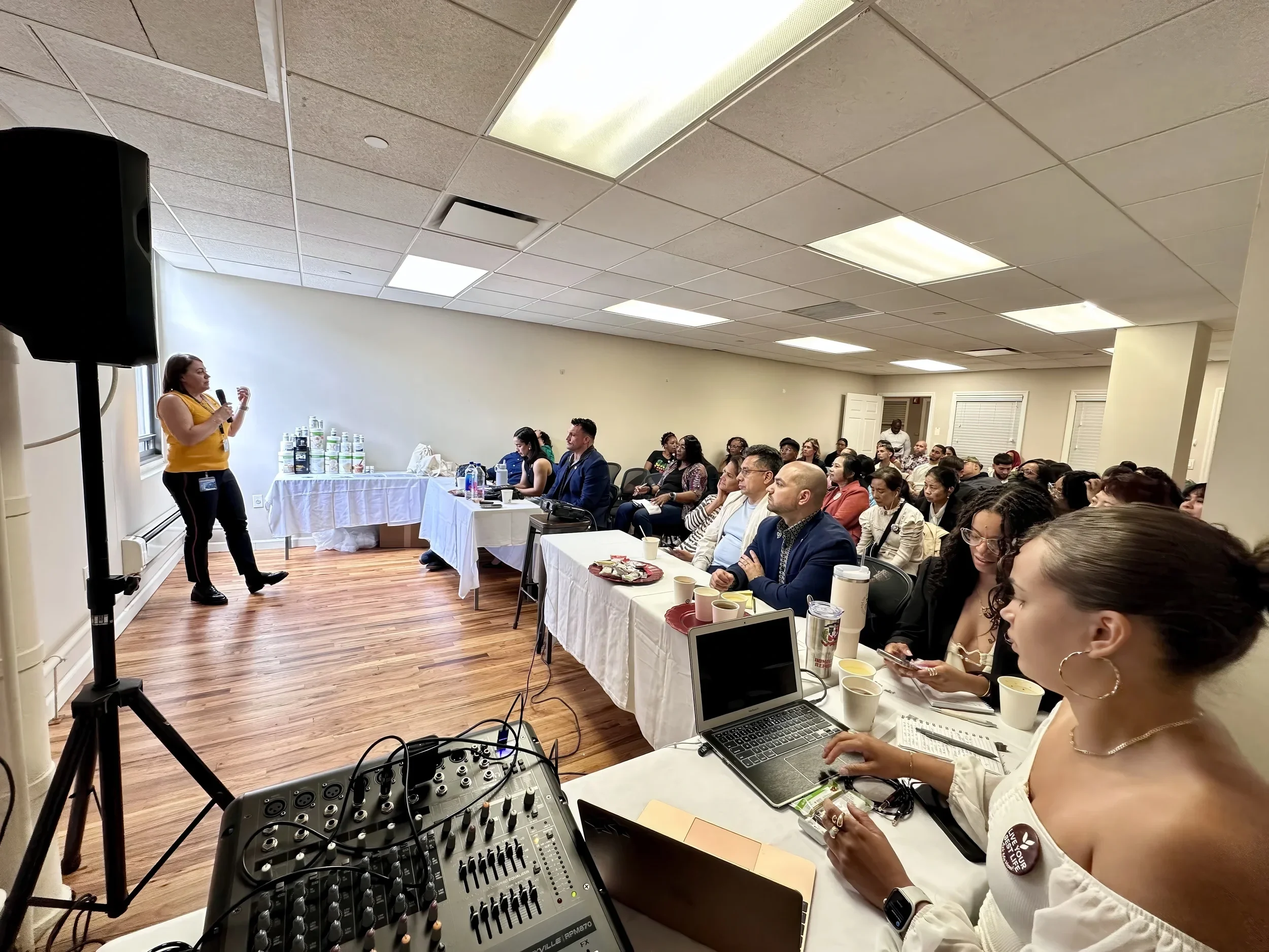 Leadership coach Irina Popa-Erwin presenting to business professionals at a corporate leadership training event in New York City.