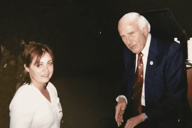 Irina Popa-Erwin with her mentor Jim Rohn at a leadership development event