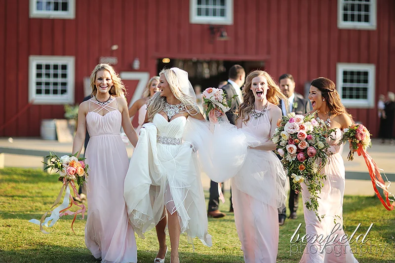 Kirsten chose Occasions bridesmaid dresses in blush. Each girl wore different styles with matching necklaces. 