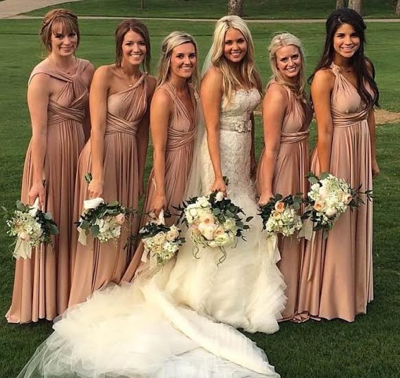 Rachel's bridesmaids wore twobirds bridesmaid wrap dresses. One dress that ties multiple ways. We love this dress not only because it's so pretty but it's also really comfortable! 