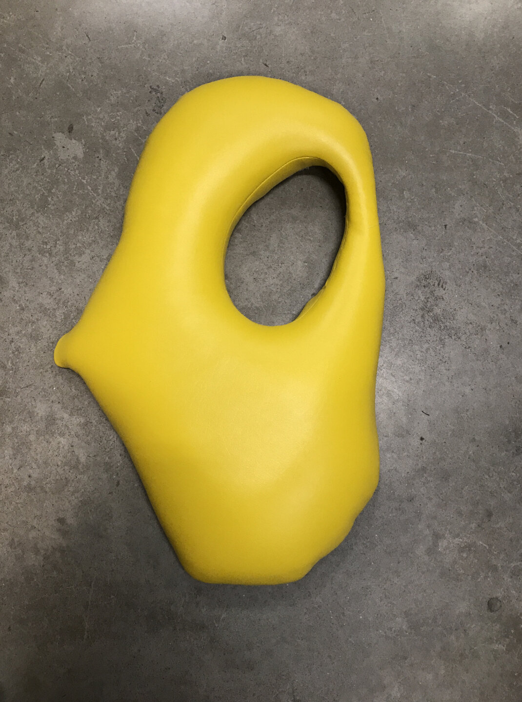 Baseera Khan, Seat 32 Yellow, 2019. Pleather 27 × 17 × 4 inches