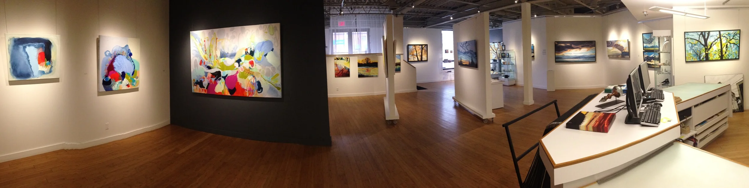 Panoramic installation shot of works by Claire Desjardins (Left) and Erica Hawkes (Right)