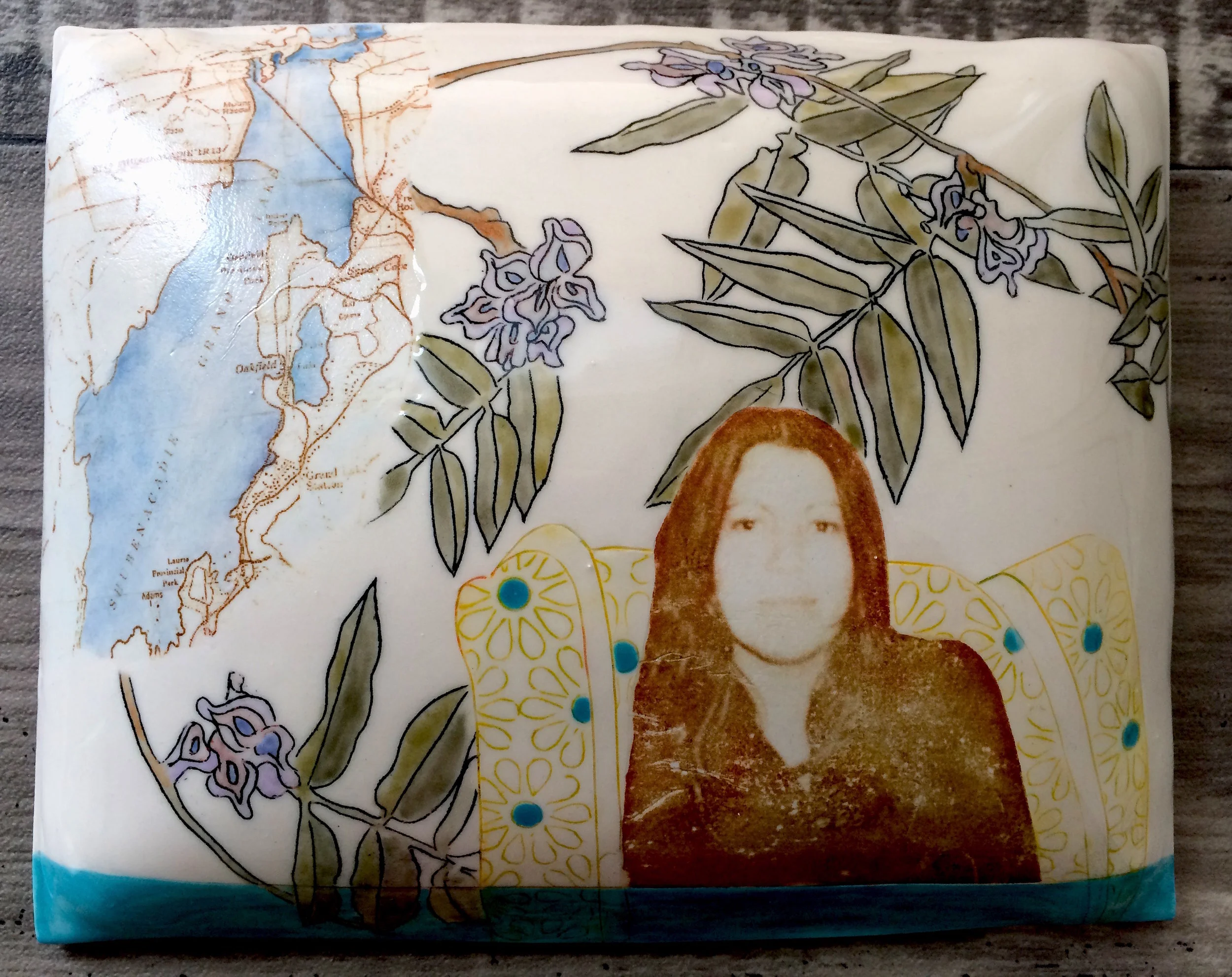 Marney McDiarmid, Anna Mae Aquash , porcelain pillow, 8" x 10" ( installation detail of Big Dreams)