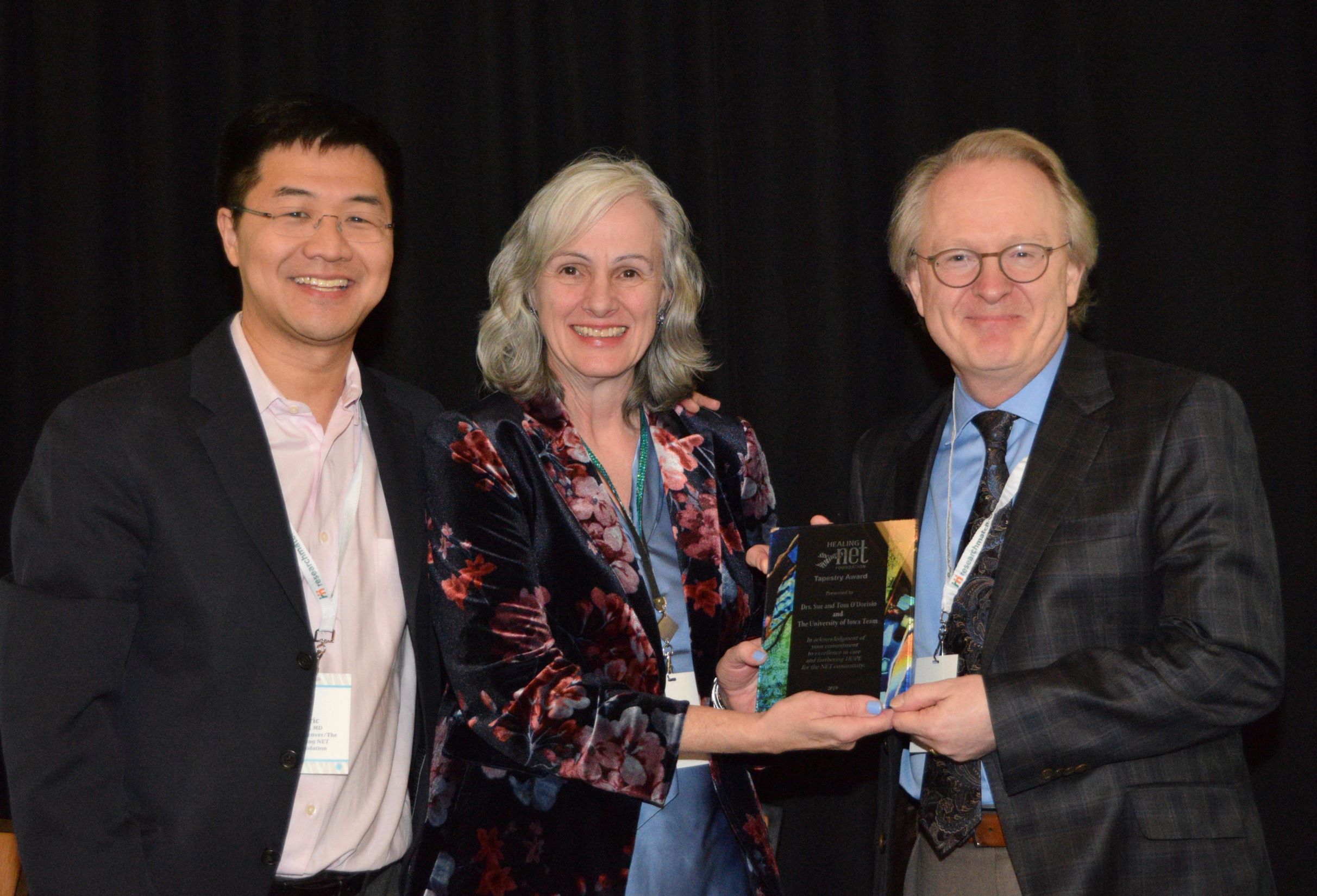 Dr. JOSEPH DILLON ACCEPTING THE AWARD ON BEHALF OF THE IOWA TEAM