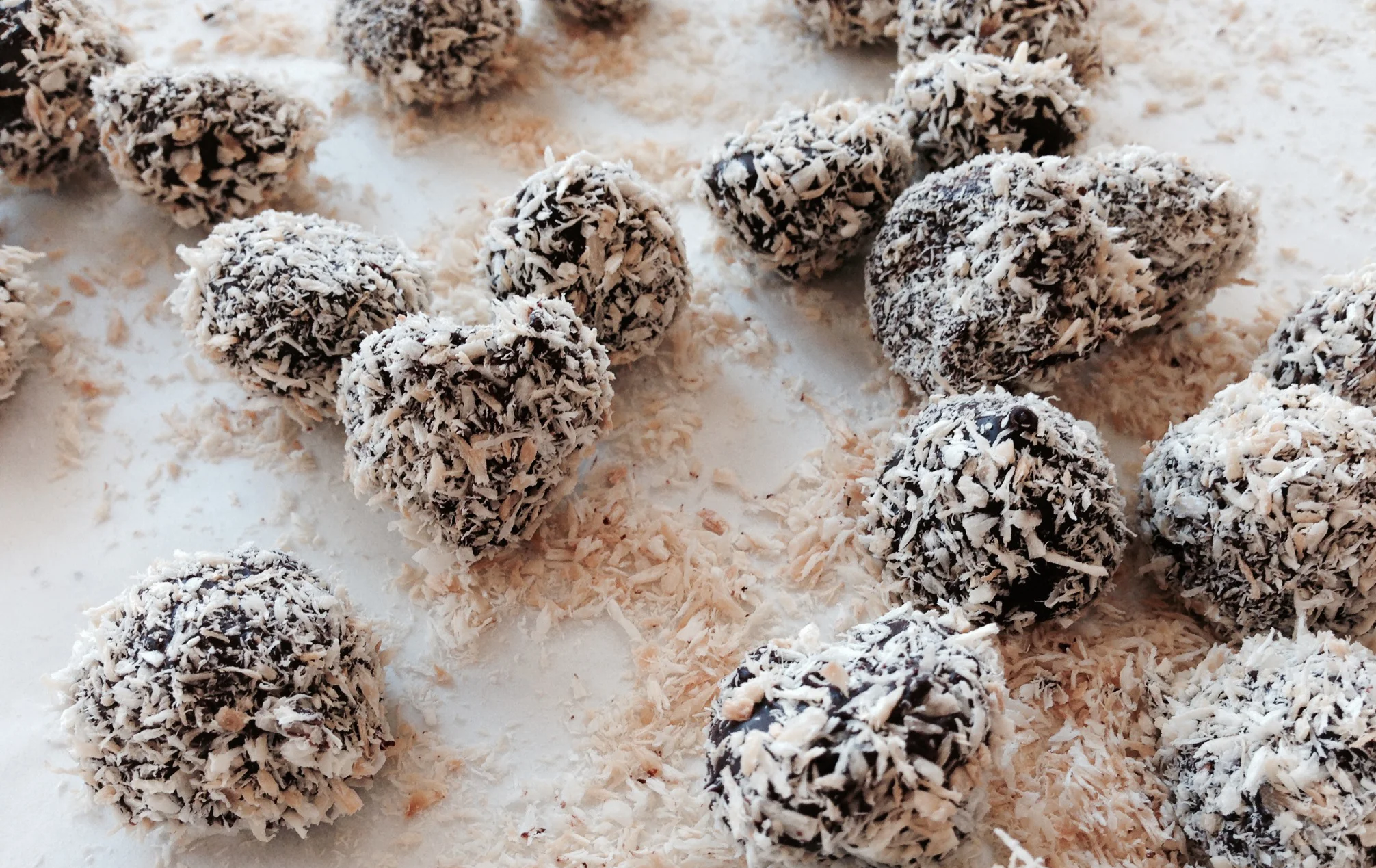 Serious milk chocolate truffle center spiced with rum, dipped in dark chocolate and rolled in toasted coconut. A winter special.