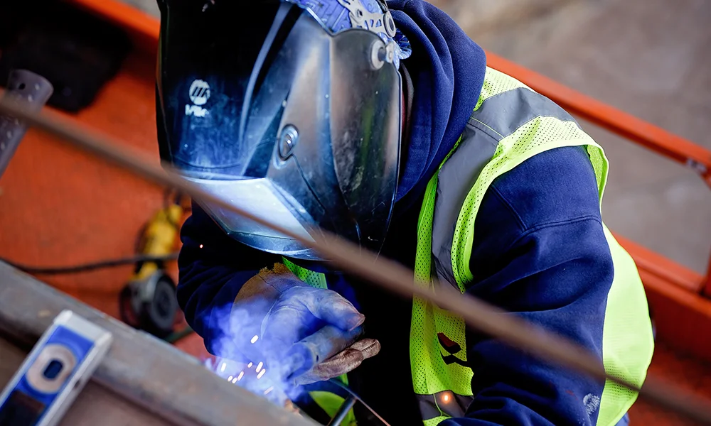A member of the Self Performance Team welds on a CMSWillowbrook project.