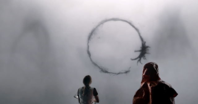 Our intrepid linguist heroine stares at filthy Heptapod graffiti. Still image from Arrival property of Paramount Pictures.