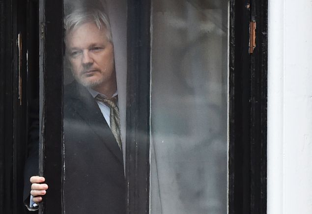WikiLeaks founder Julian Assange comes out on the balcony of the Ecuadorian embassy to address the media in central London on February 5, 2016. Photo: BEN STANSALL/AFP/Getty Images
