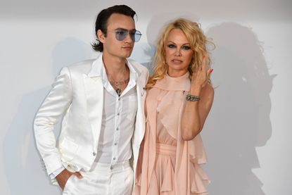 Brandon Thomas Lee and his mother, Pamela Anderson, stop for photos as they arrive last month for amfAR's 26th Cinema Against AIDS gala at the Hotel du Cap-Eden-Roc in Cap d'Antibes in France. (Alberto Pizzoli / AFP / Getty Images)