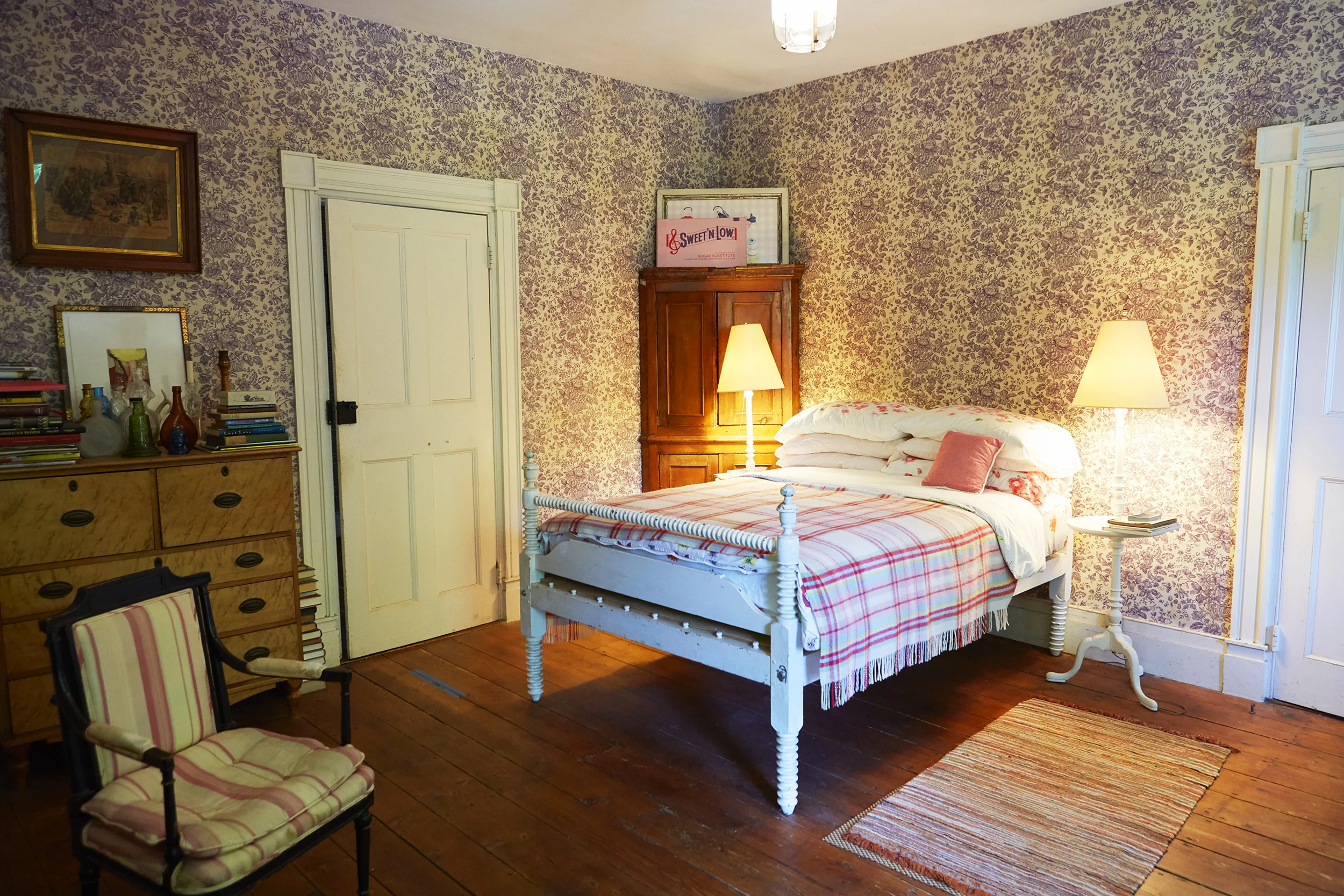 Guest bedroom features Sweet and Low by Sylvie Fleury.