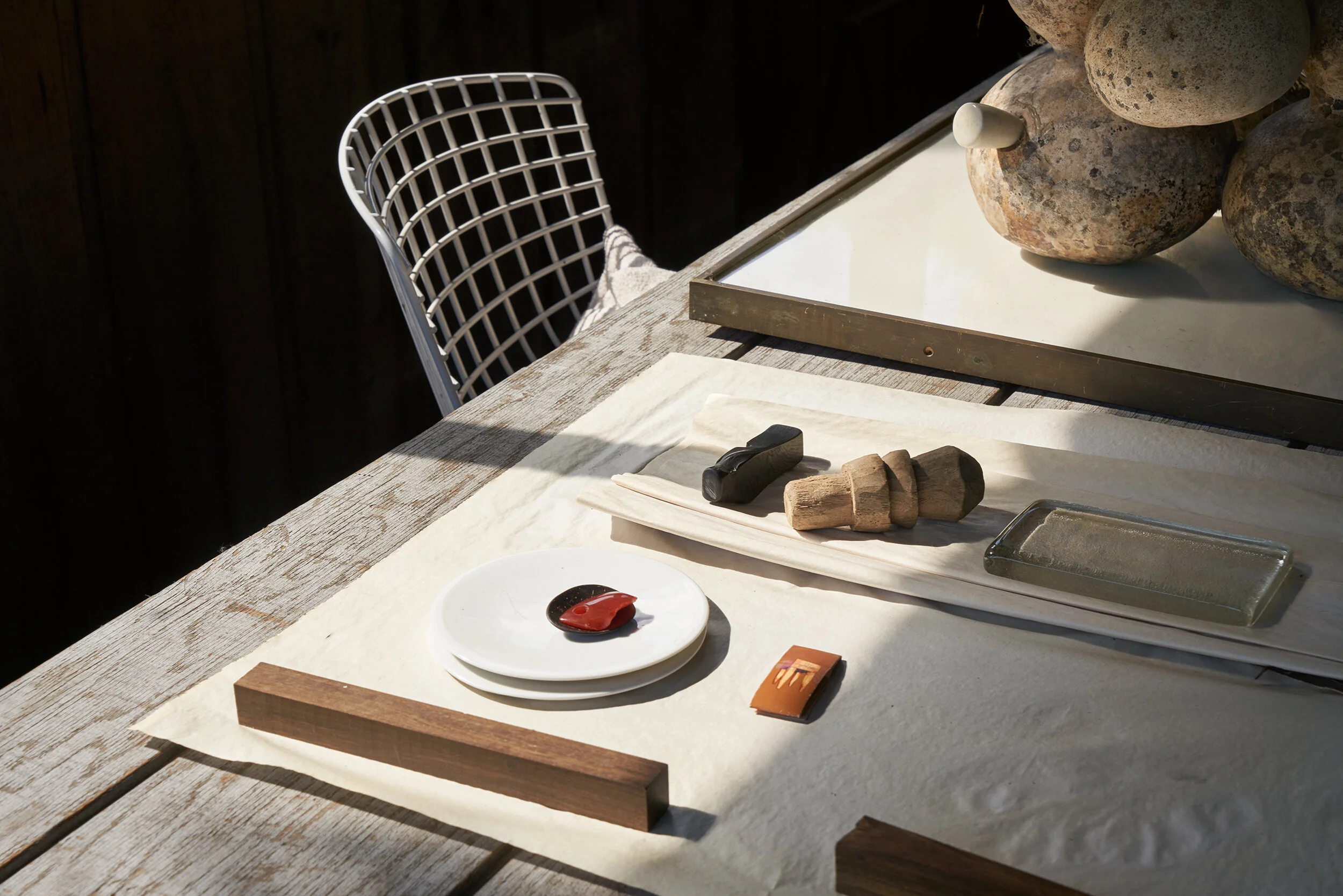 Studio table with components for assemblages.