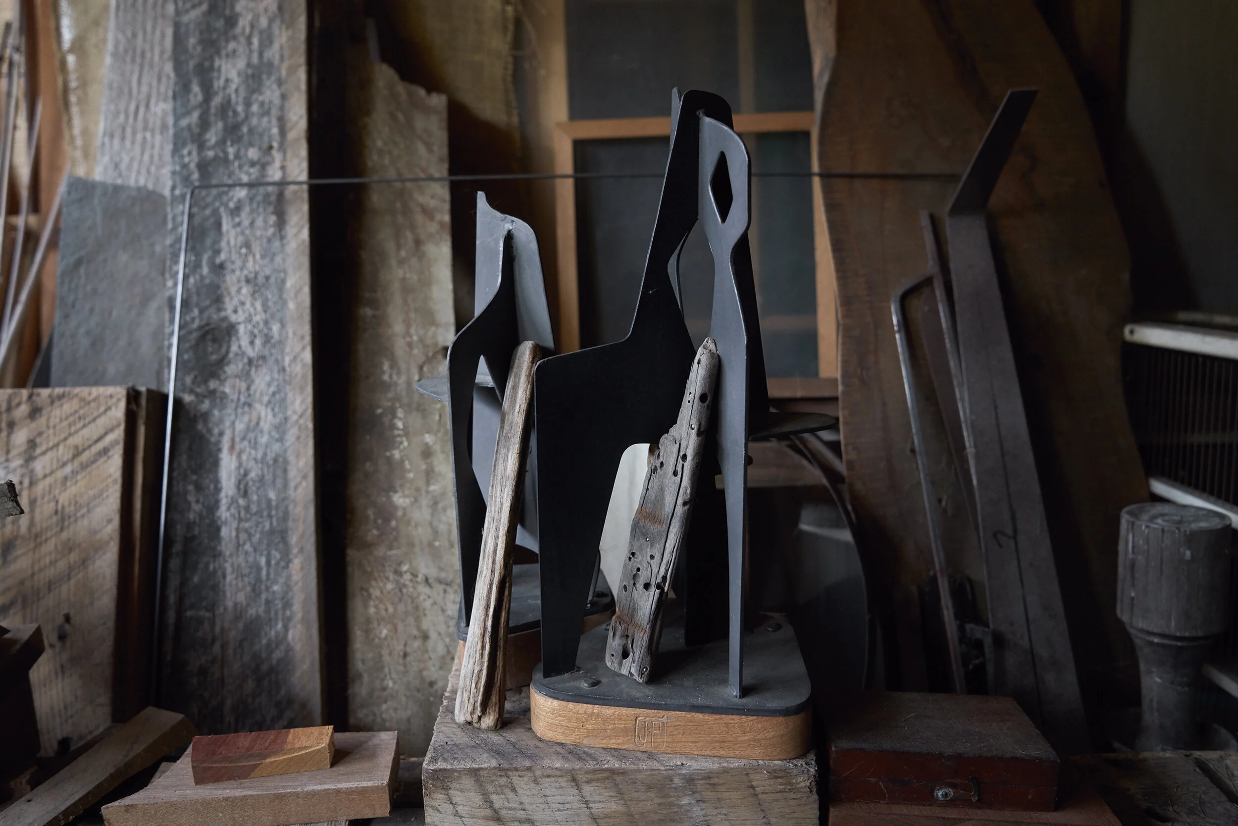 Steel candelabrums (with leaning driftwood), 2015.