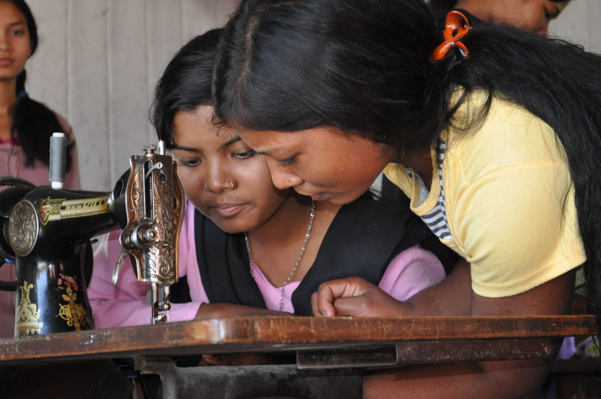 2 girls threading.JPG
