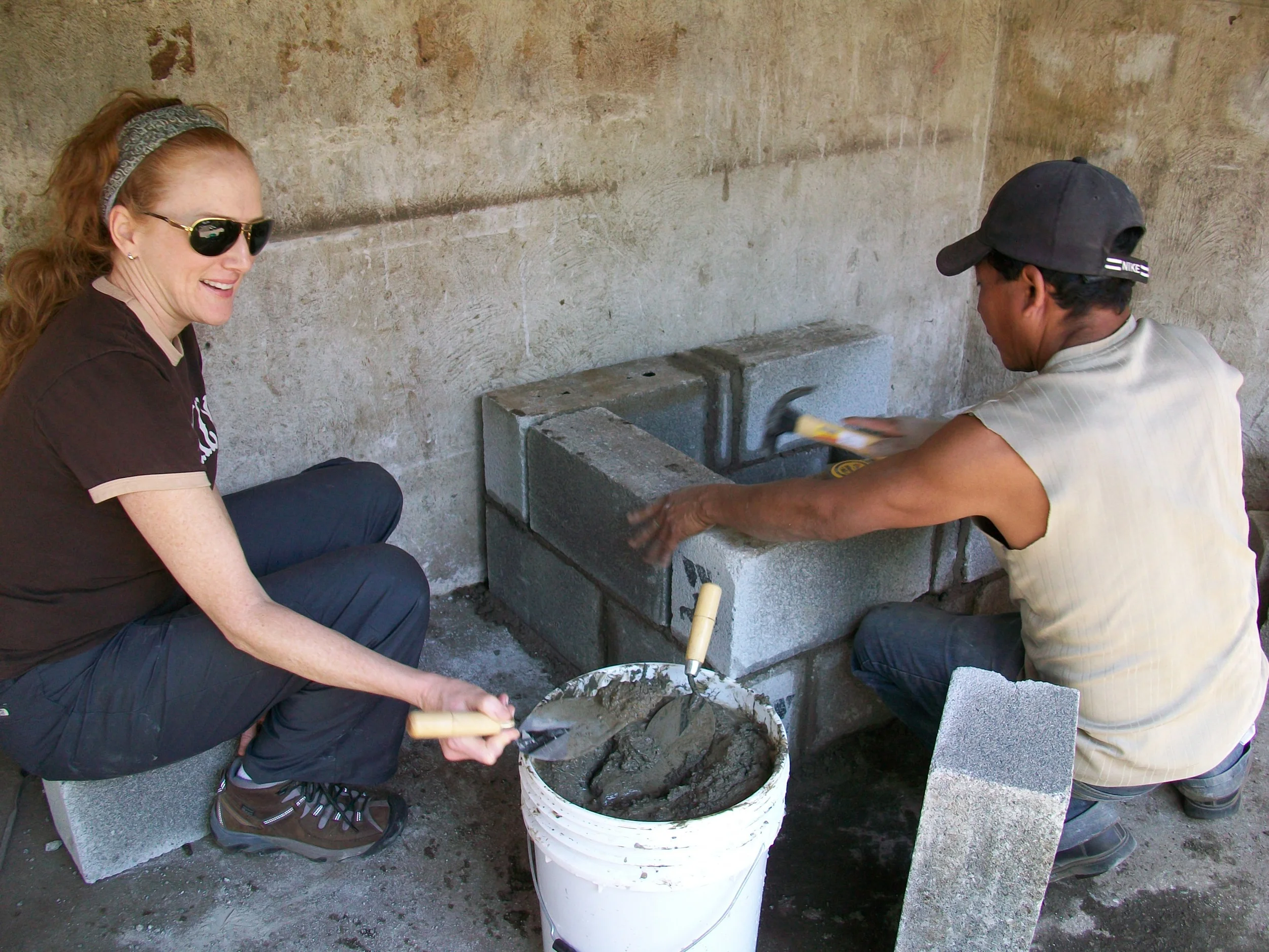 Betsey works on stove.JPG