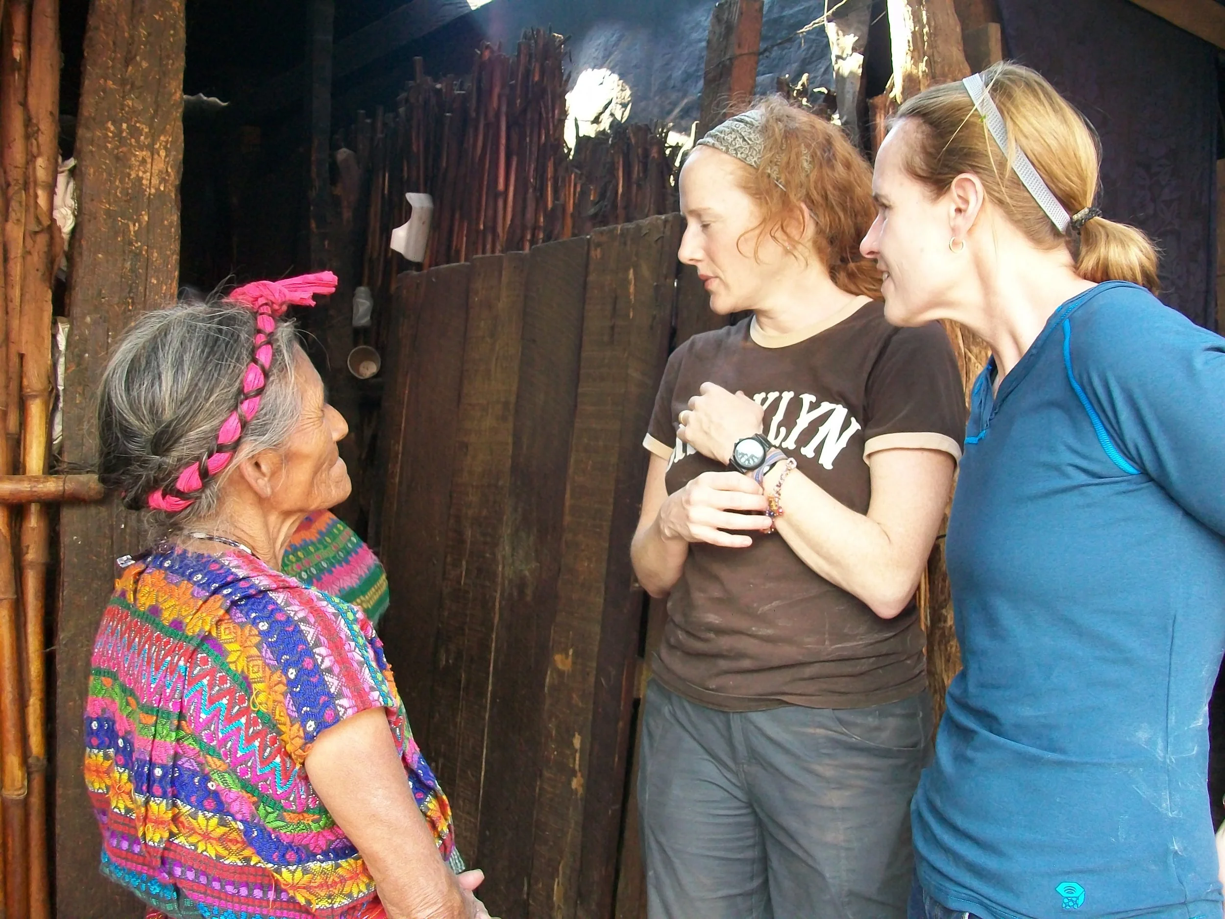 Girls talking to Mayan women.JPG